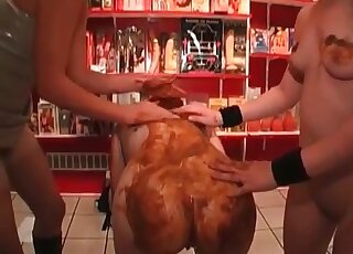 Anal fingering and lots of messy scat play in the store